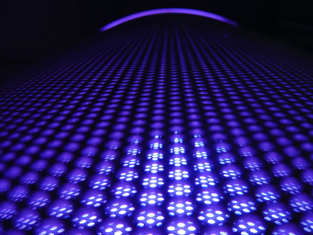 services-01 A captivating abstract image featuring glowing purple spheres in a dynamic pattern.